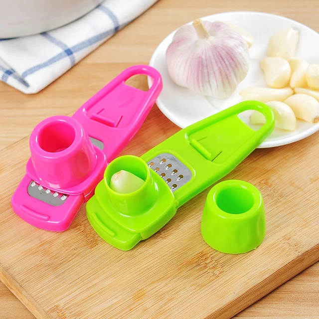 Garlic Press Grater & Slicer – Manual Garlic Grinding Tool for Kitchen – Compact Plastic Garlic Mincer (Random Color)